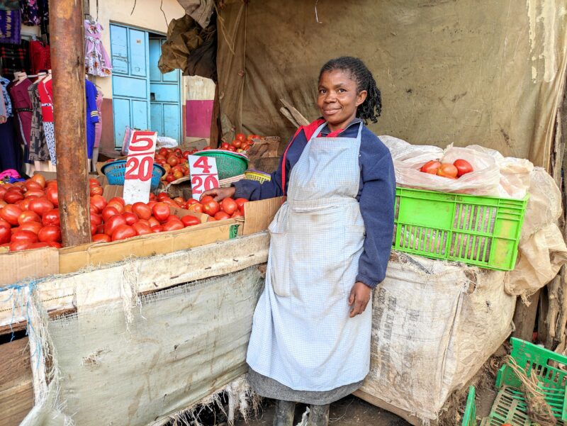 Balolwa poses next to her stall in Githurai market