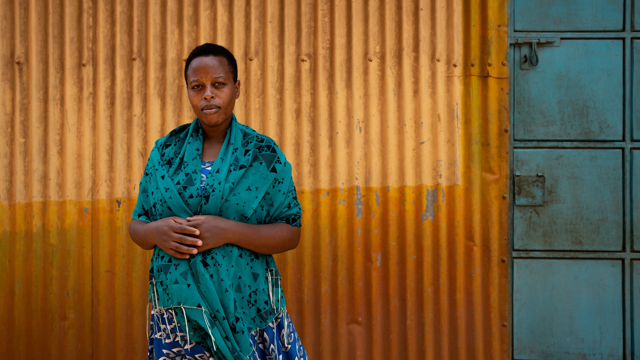 woman standing against orange background