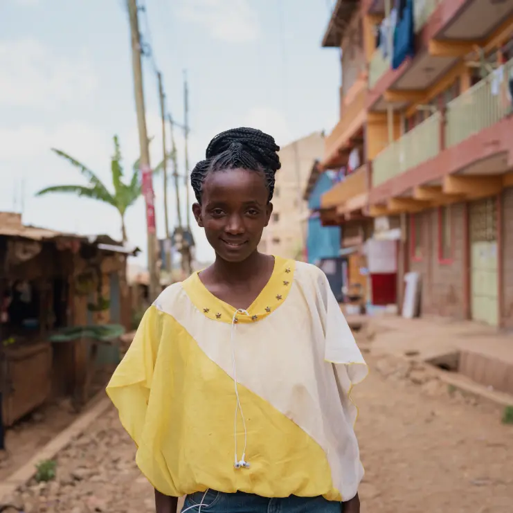 woman in a yellow shirt smiling