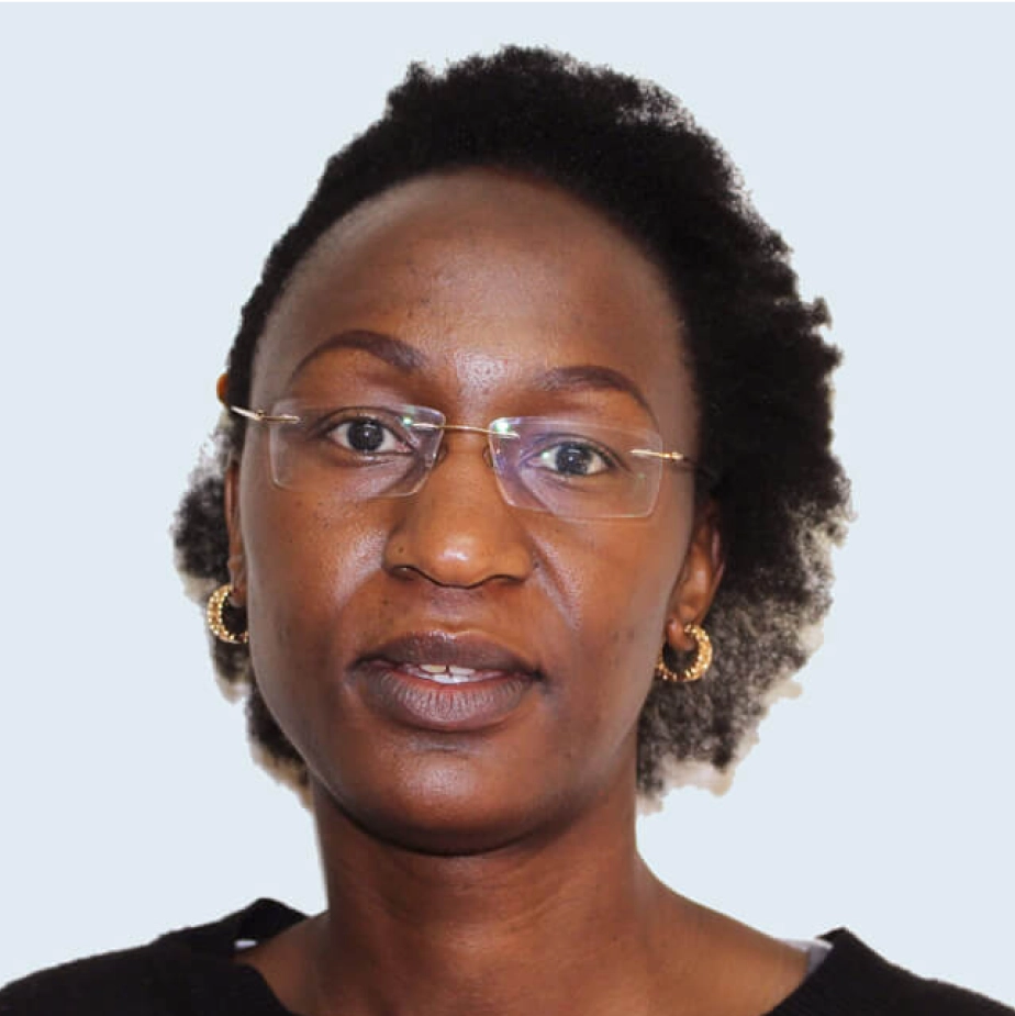 woman with glasses and earrings smiling