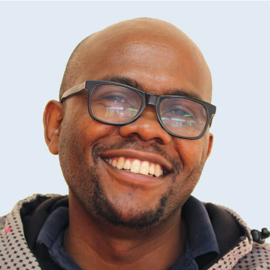 man with glasses smiling