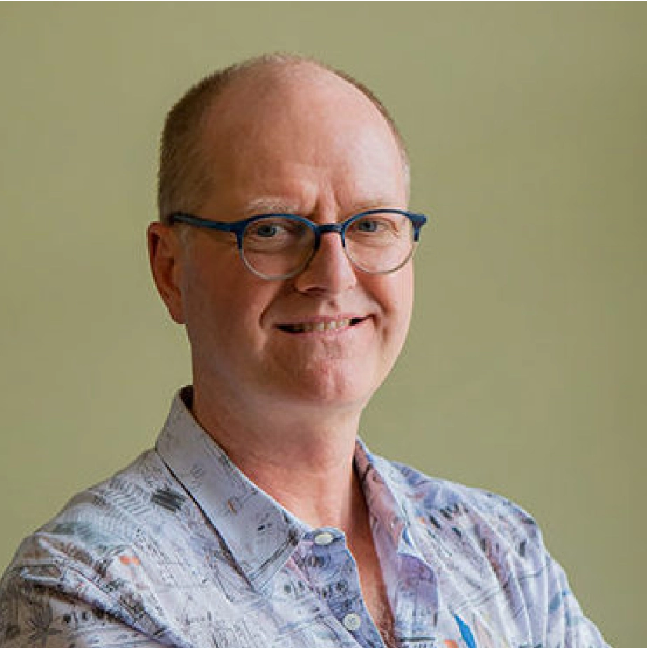 man with glasses smiling