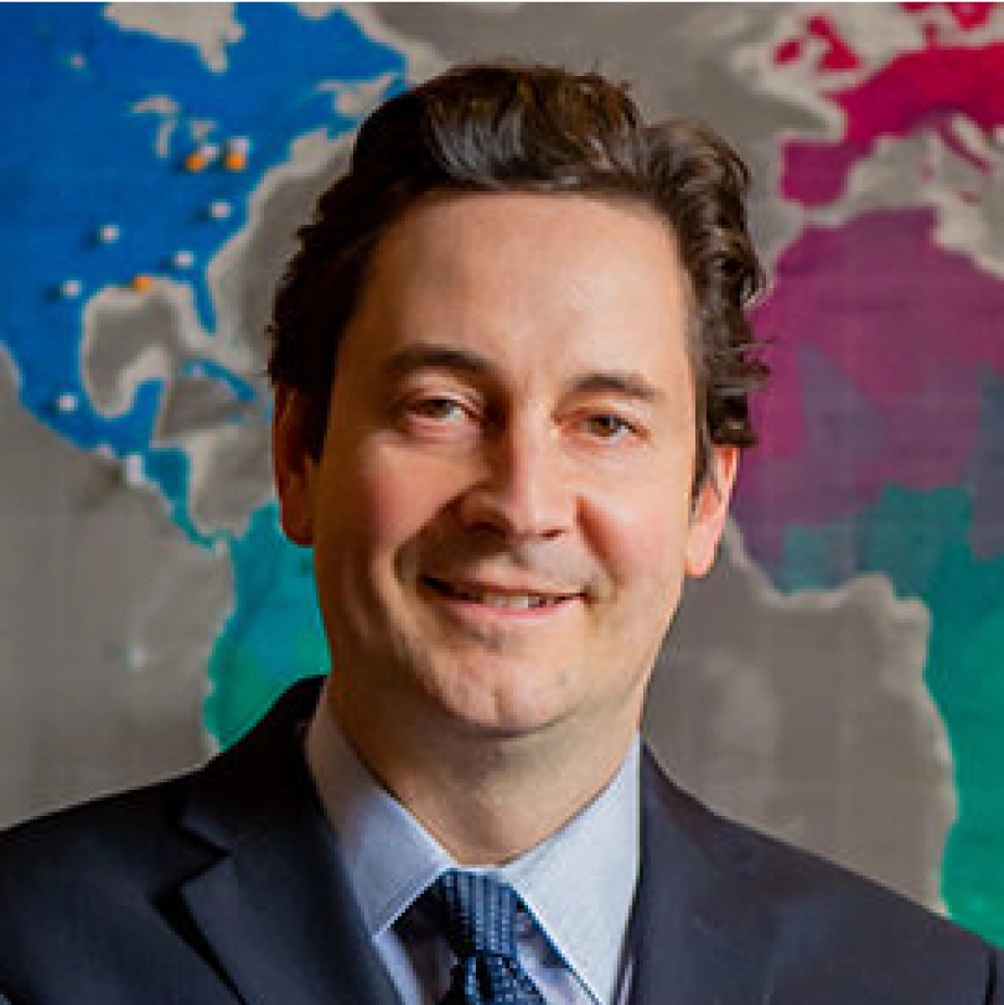 man in a suite smiling