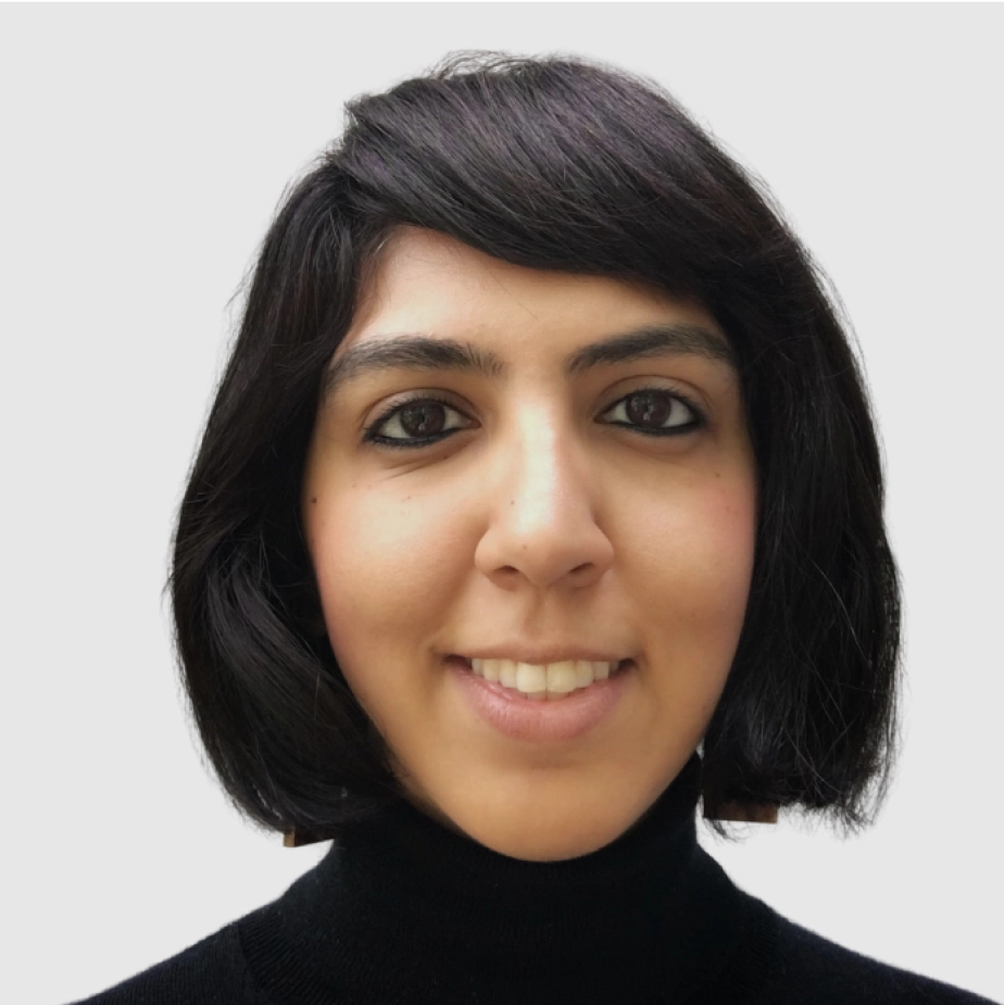 woman in a black turtle-neck smiling