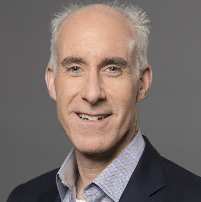 man in a suit smiling