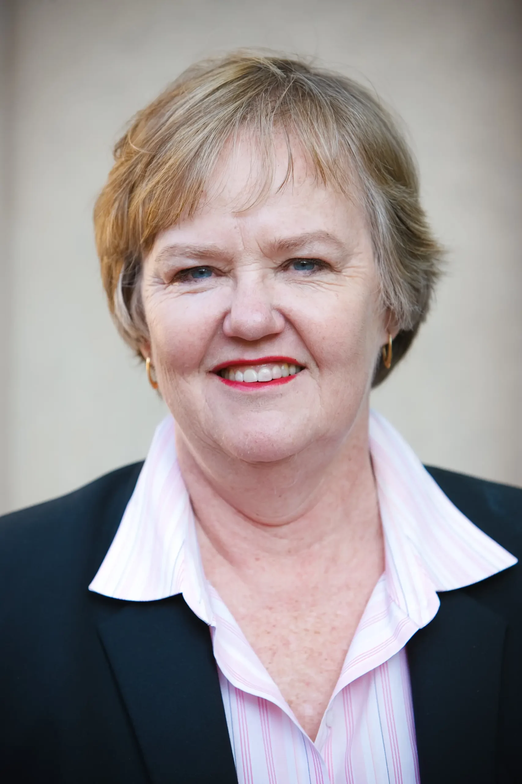 woman in a suit smiling
