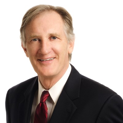 man in a suit with tie smiling