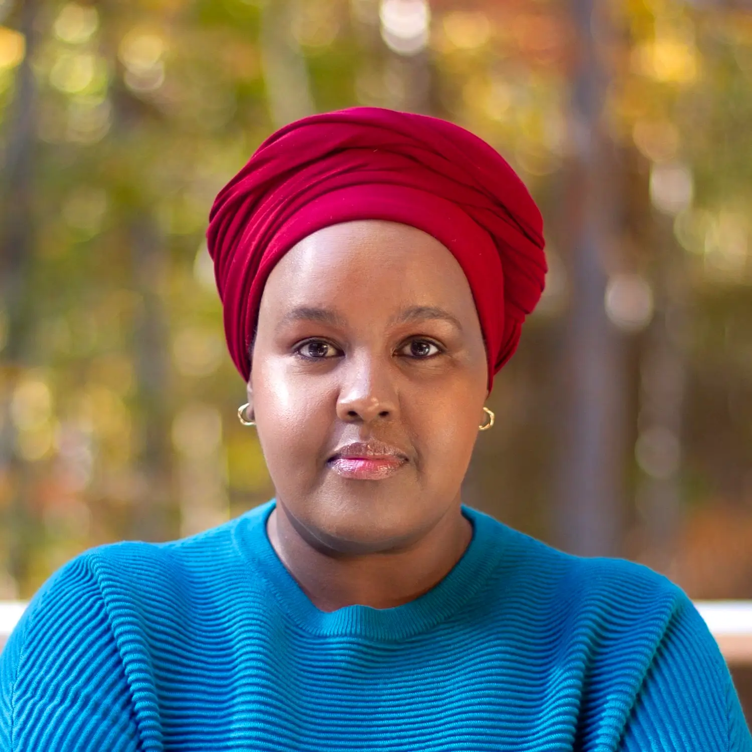 woman in a blue sweater posing