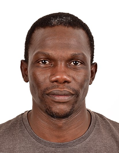 man in a brown shirt posing